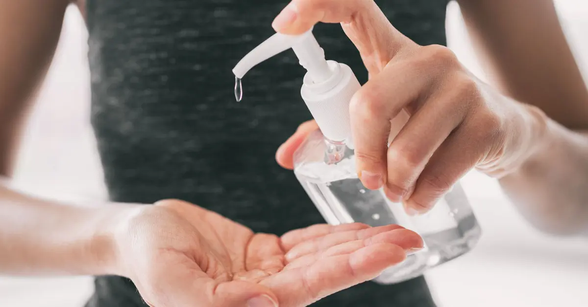 Photo of a woman using a gel pump, showing that hand sanitizer safety is important